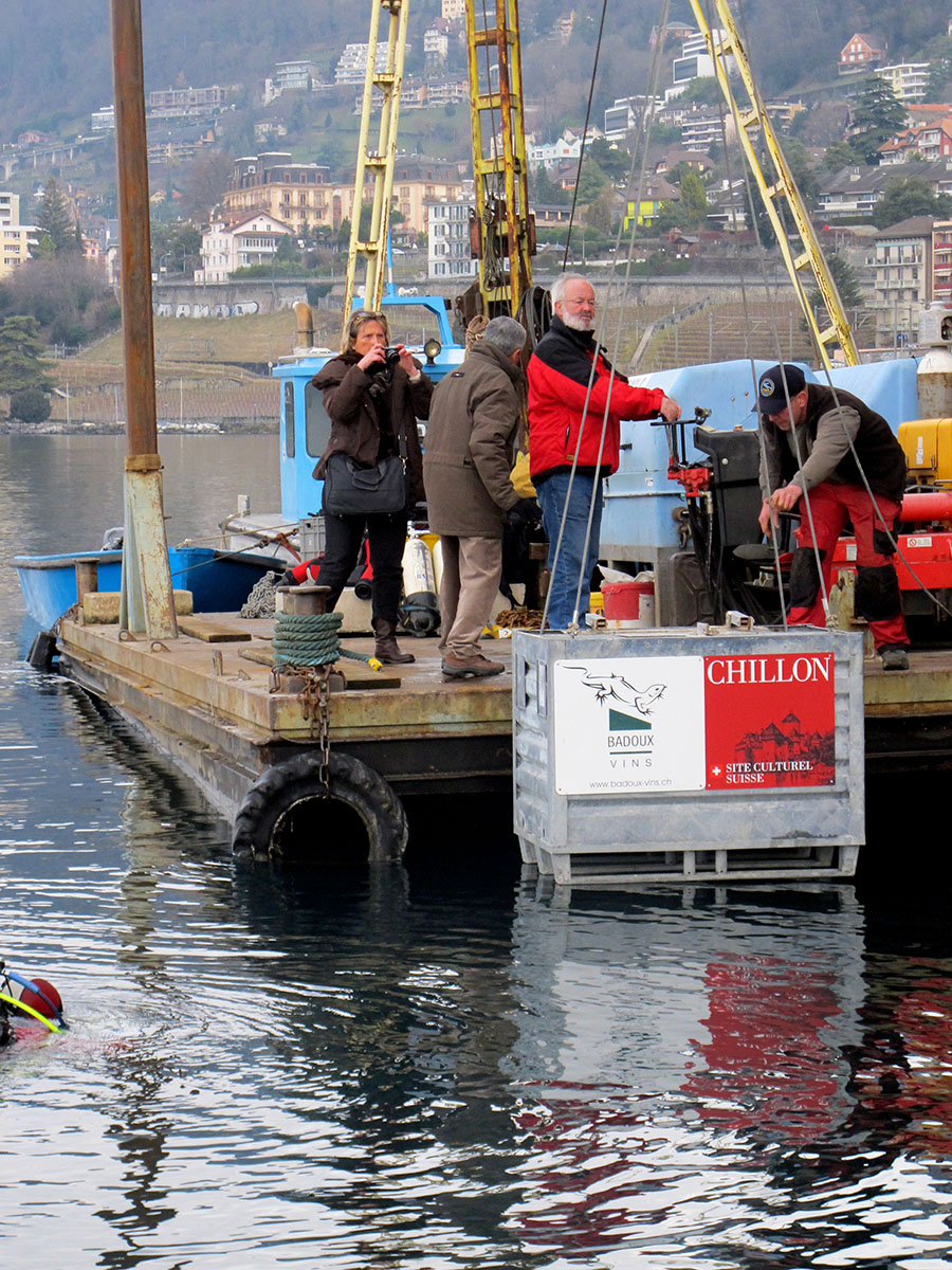 Wines from Chateau de Chillon and Badoux winery (which makes the Clos de Chillon for the chateau) are lowered into Lake Geneva 16 January 2014, where they will sit for months, possibly years
